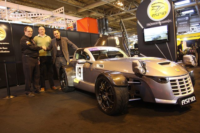 Britcar founder James Tucker, race driver Rob Hedley and IFR founder Ignacio Fernandez, pictured with IFR Aspid at the Autosport International racing car show.