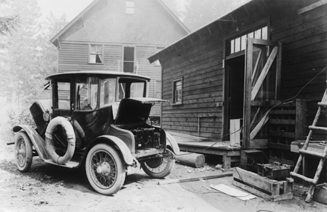 Electric car from early 20th century charging 