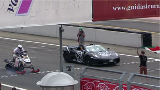what happens when snowmobile enters a head to head drag race vs ferrari [video]