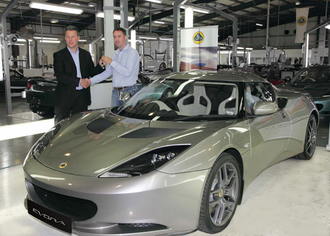 Luke Bennett, Director of Lotus Cars (left) hands over the keys of the first customer Lotus Evora to Mr Matthew Melling at the Lotus Headquarters in Norfolk, UK.